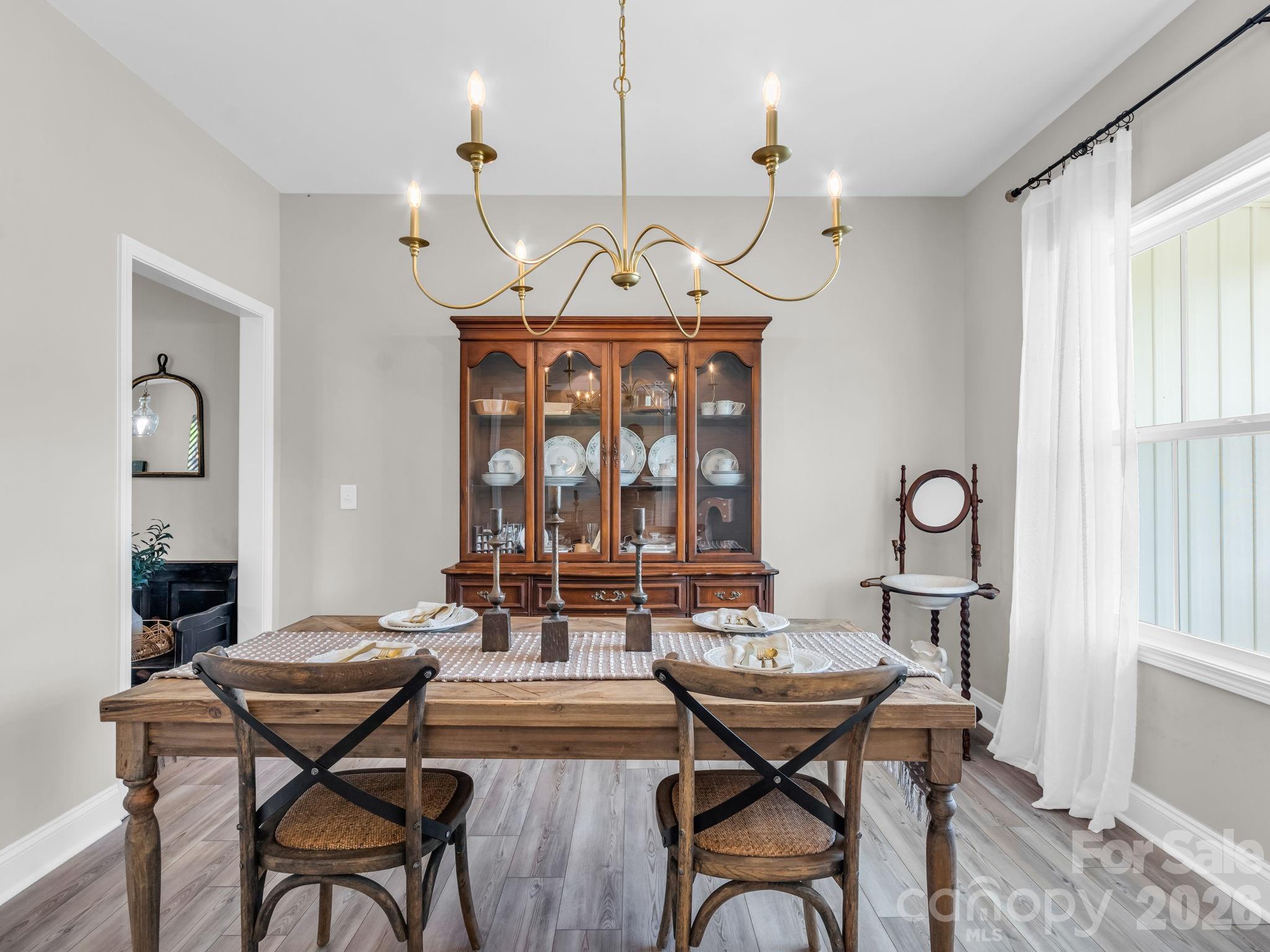 288 Maypole Court Forest City, NC 28043 - Photo 14 of 47 a view of a dining room with furniture window and wooden floor