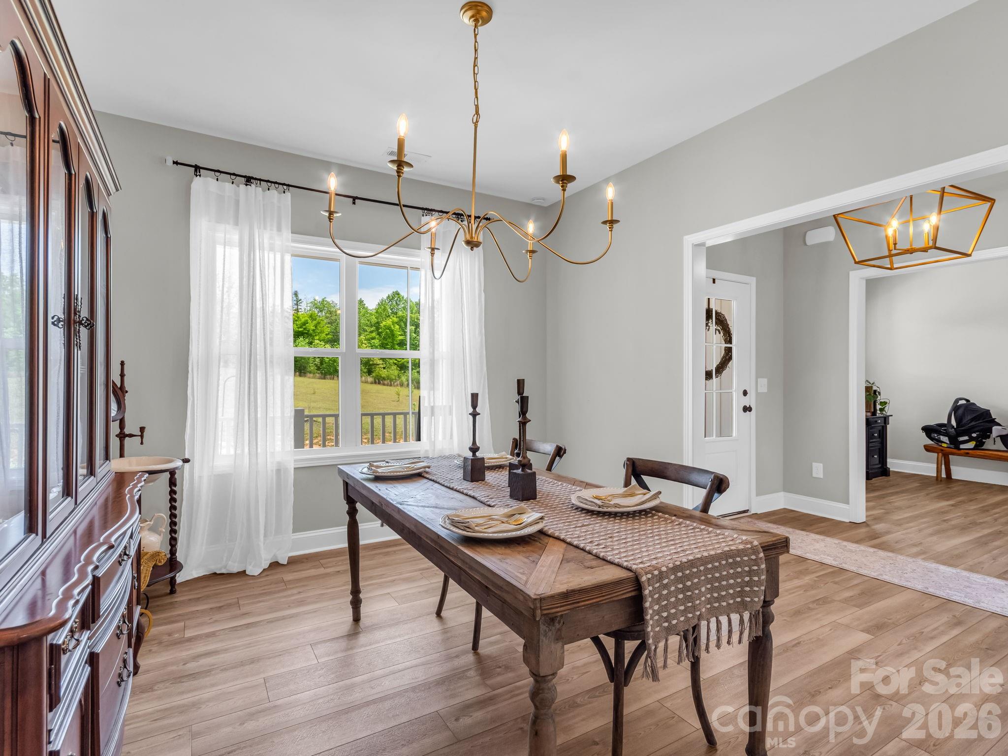 288 Maypole Court Forest City, NC 28043 - Photo 15 of 47 a view of a dining room with furniture window and wooden floor