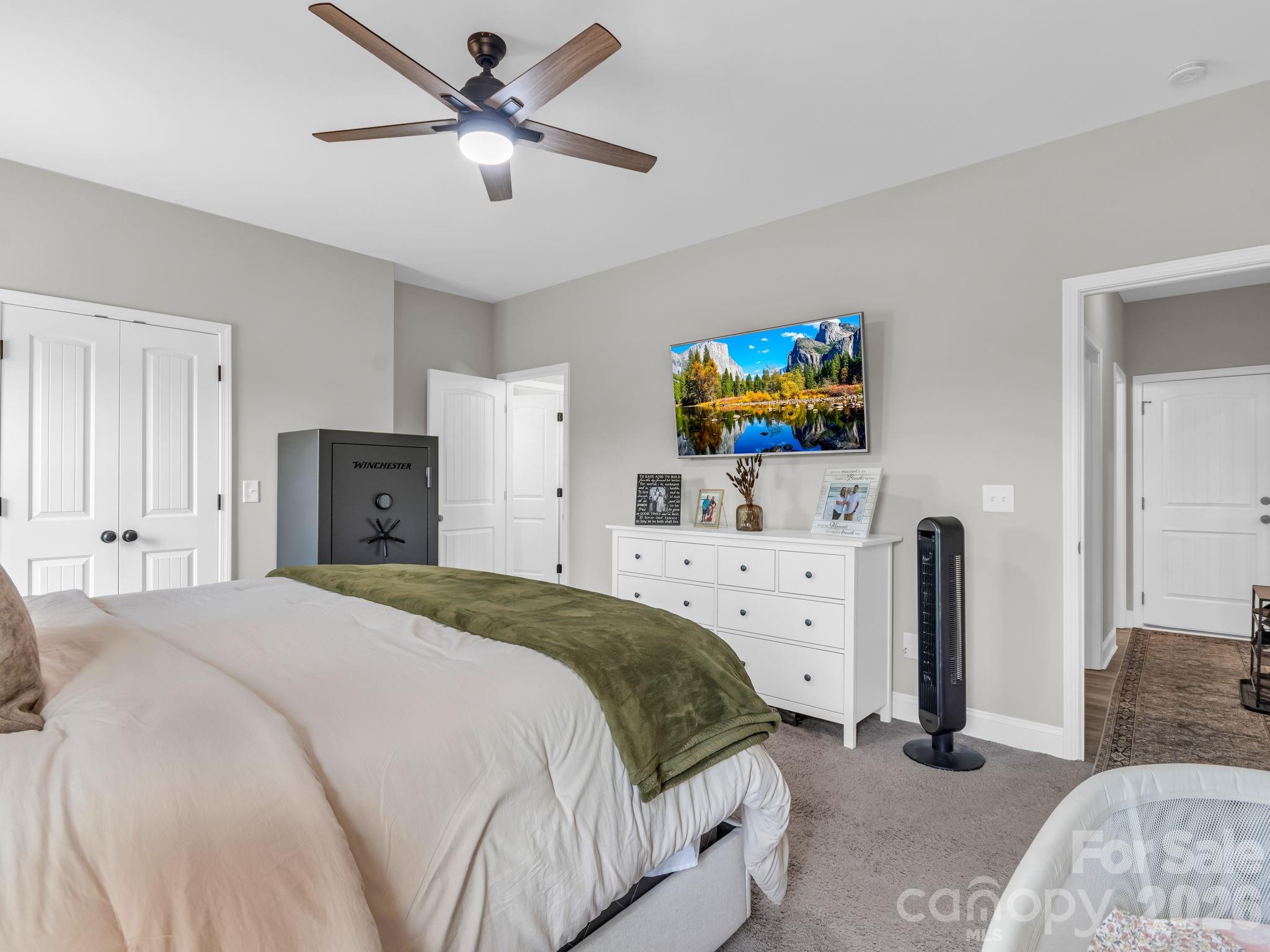 288 Maypole Court Forest City, NC 28043 - Photo 18 of 47 a bedroom with a bed and a flat screen tv