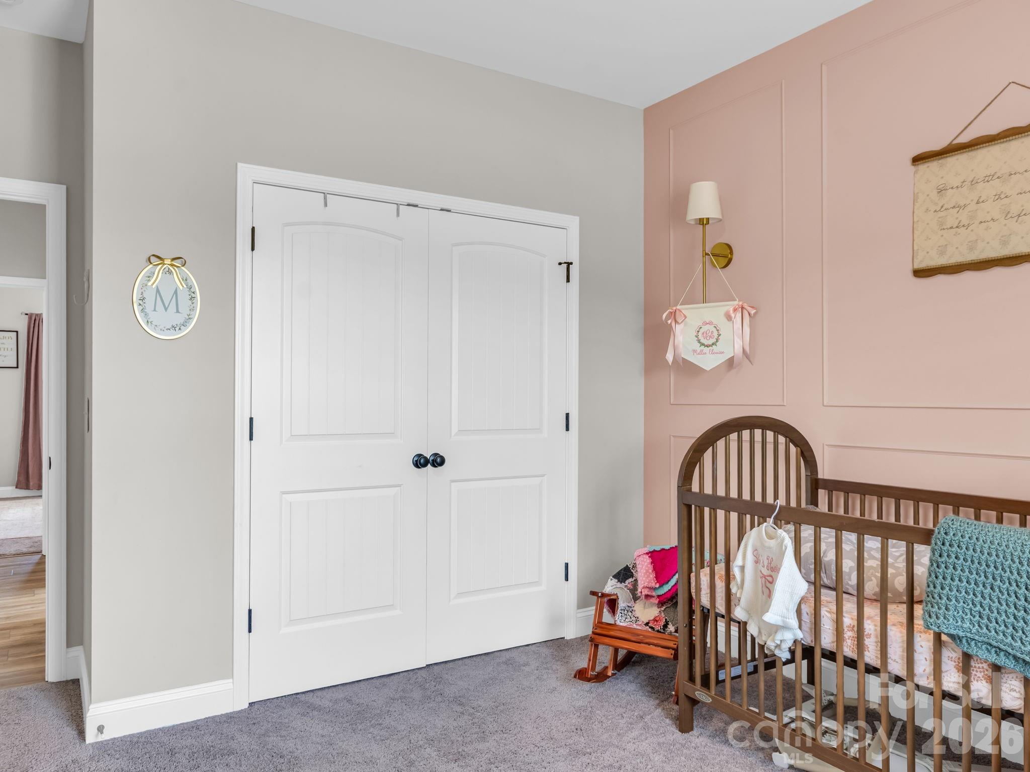 288 Maypole Court Forest City, NC 28043 - Photo 24 of 47 a living room with baby crib furniture and a window