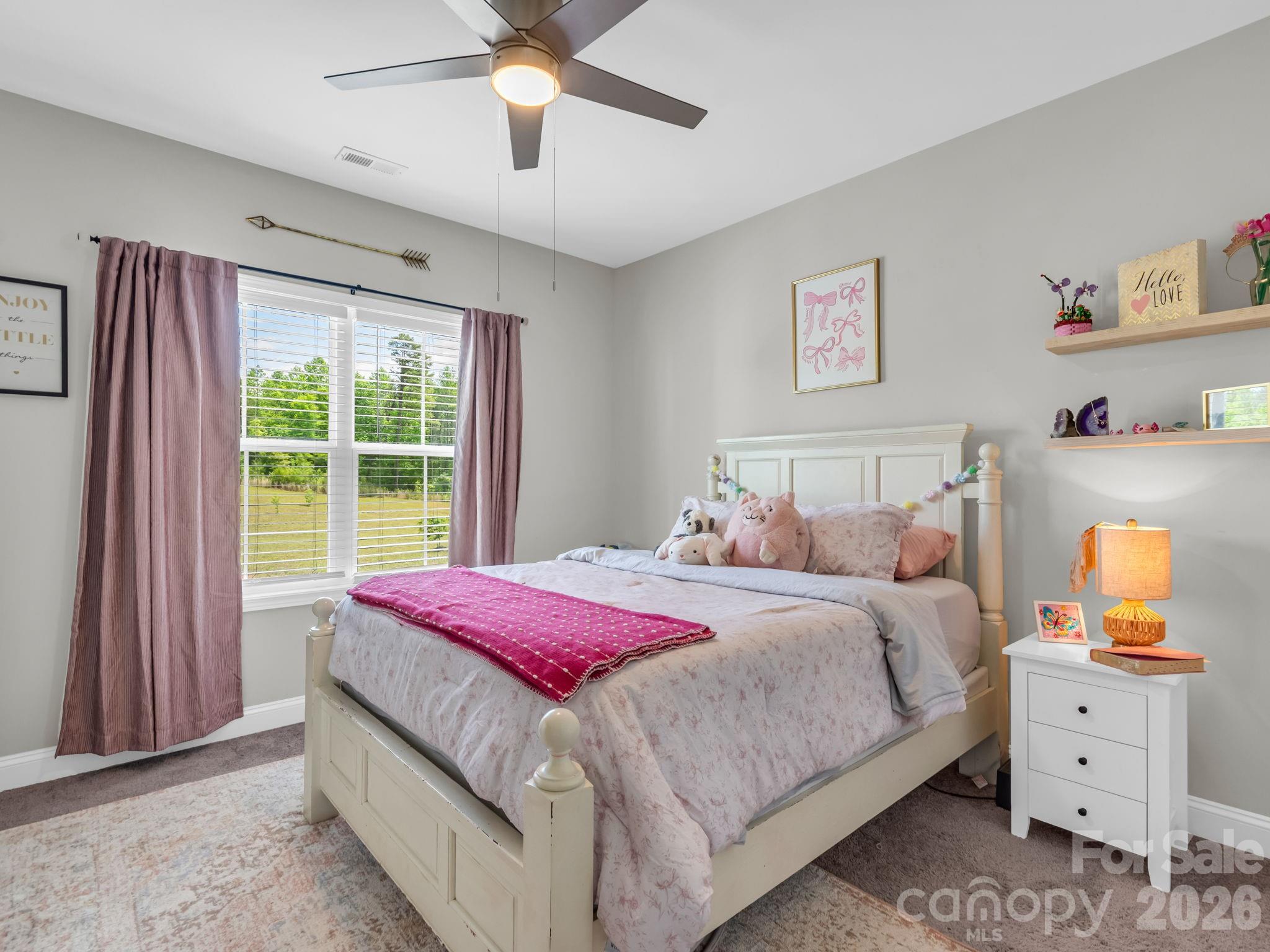288 Maypole Court Forest City, NC 28043 - Photo 27 of 47 a bedroom with a bed and a window