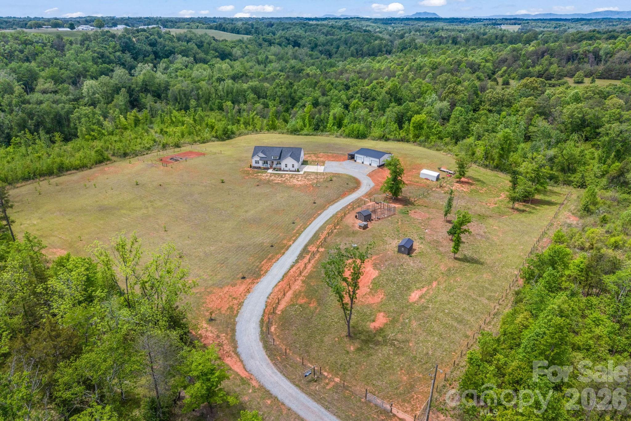 288 Maypole Court Forest City, NC 28043 - Photo 41 of 47 an aerial view of a house with a yard and large trees
