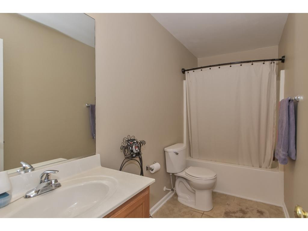 1223 Maple Burlington, NC 27217 - Photo 12 of 24 a bathroom with a sink toilet and shower