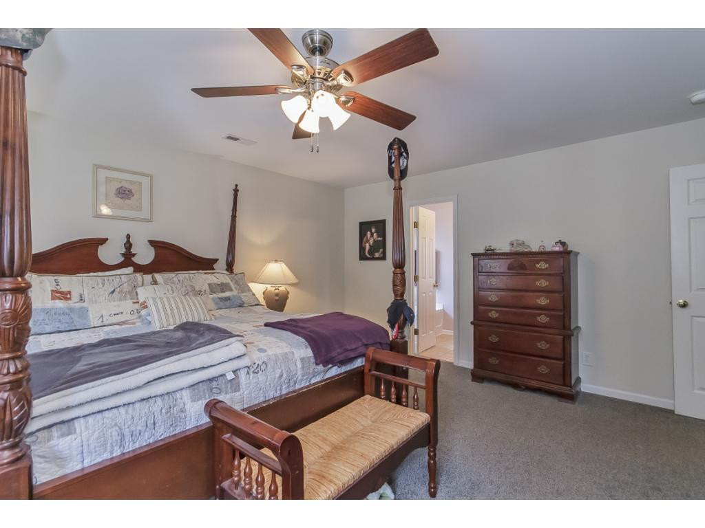 1223 Maple Burlington, NC 27217 - Photo 15 of 24 a bedroom with bed and window