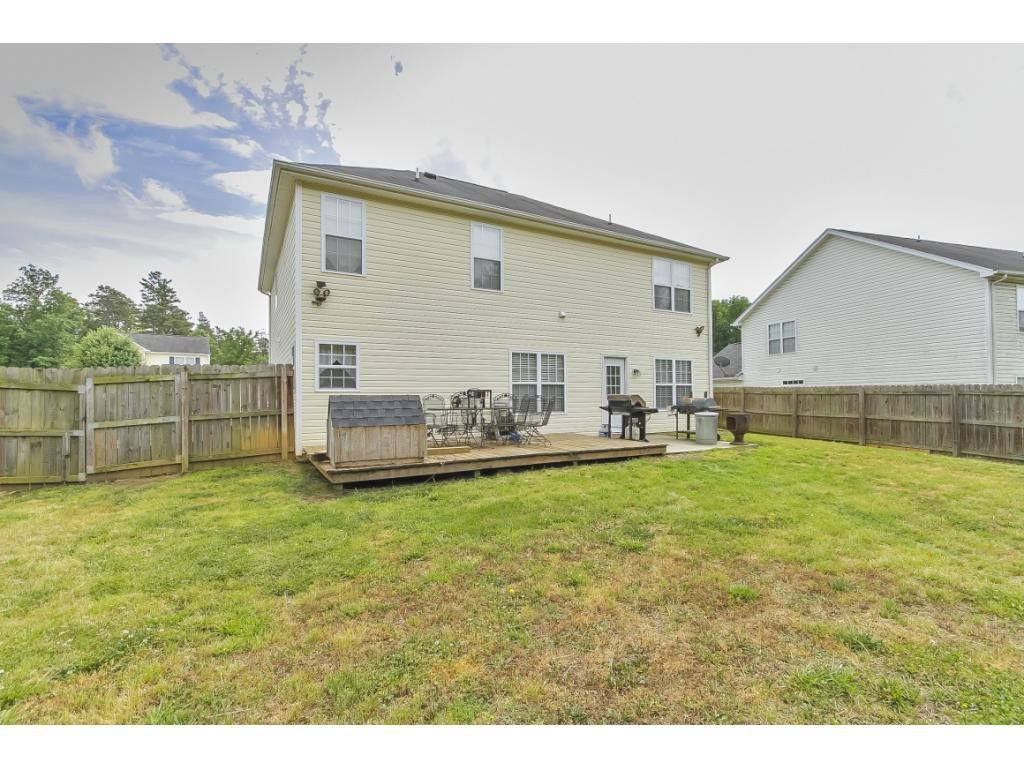 1223 Maple Burlington, NC 27217 - Photo 24 of 24 a view of a house with a yard and sitting area