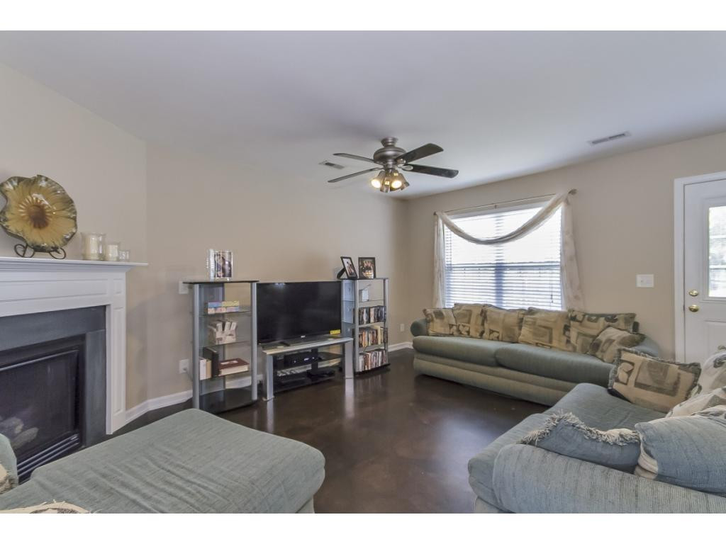 1223 Maple Burlington, NC 27217 - Photo 3 of 24 a living room with furniture and a fireplace
