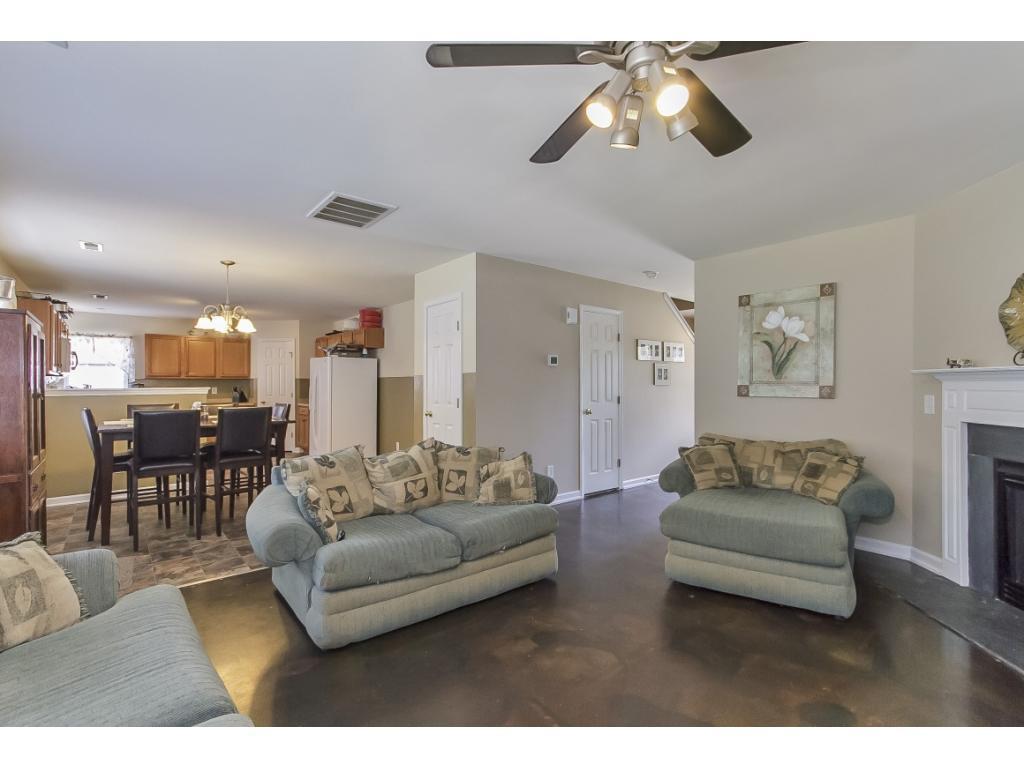 1223 Maple Burlington, NC 27217 - Photo 5 of 24 a living room with furniture and a chandelier