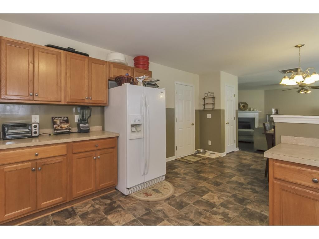1223 Maple Burlington, NC 27217 - Photo 10 of 24 a kitchen with refrigerator cabinets and a sink