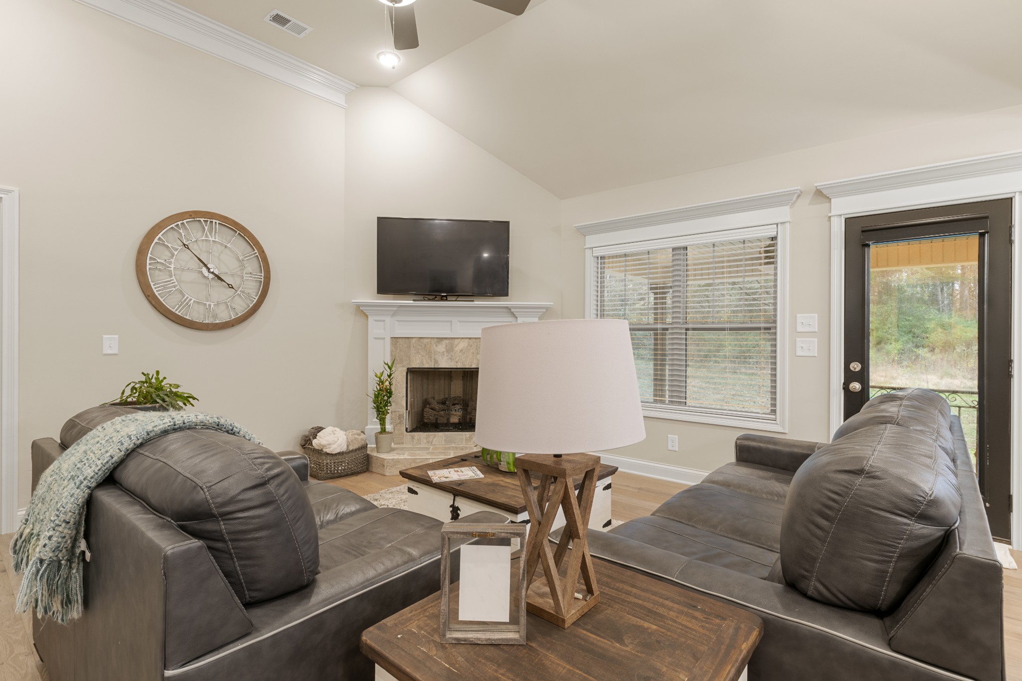 321 Timber Lane Lebanon, TN 37087 - Photo 12 of 34 Great Room With Gas Logs And Hardwood Flooring With Access To Covered Back Patio