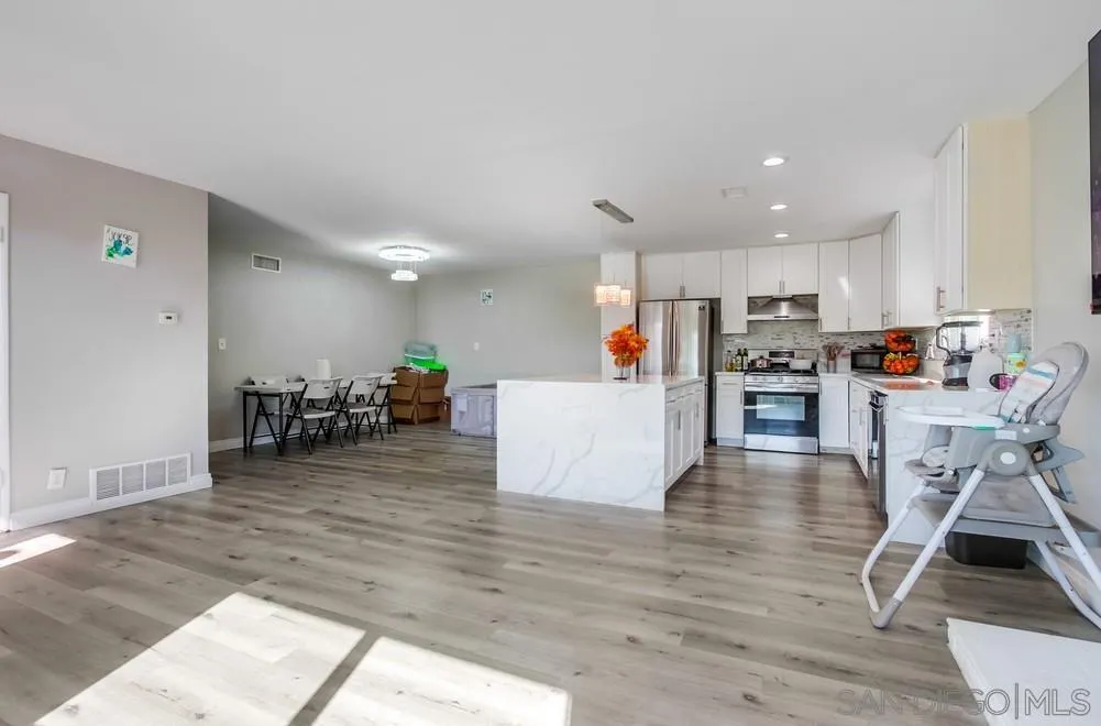 634 Daisy Street Escondido, CA 92027 - Photo 11 of 57 a living room with furniture and a wooden floor