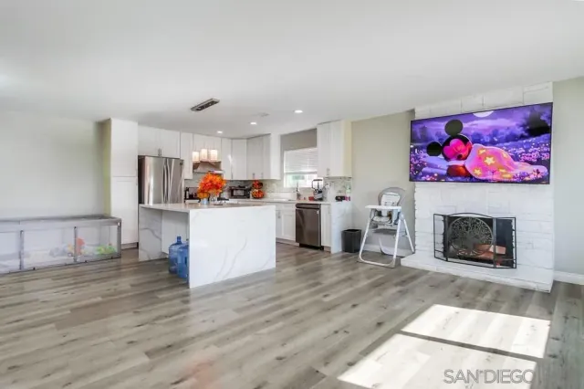 a view of a living room and dining room