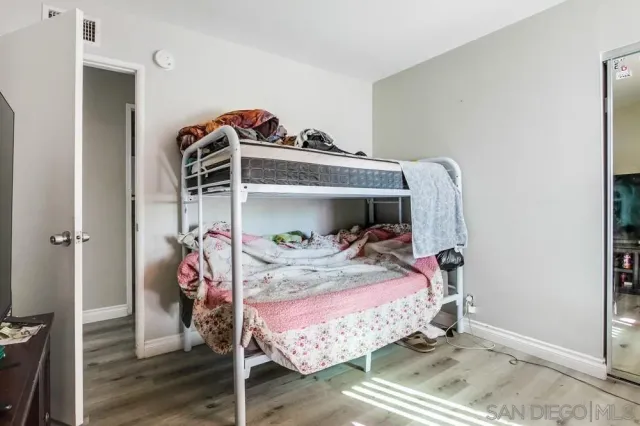 a bedroom with a bed and a couch