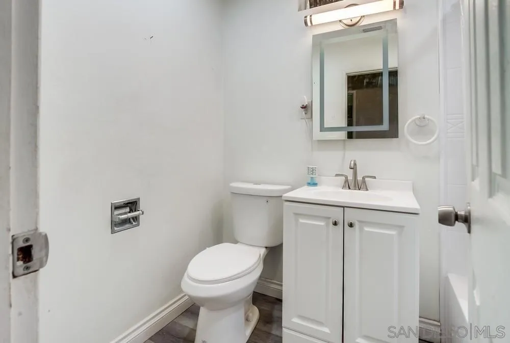 634 Daisy Street Escondido, CA 92027 - Photo 33 of 57 a bathroom with a sink a toilet and mirror