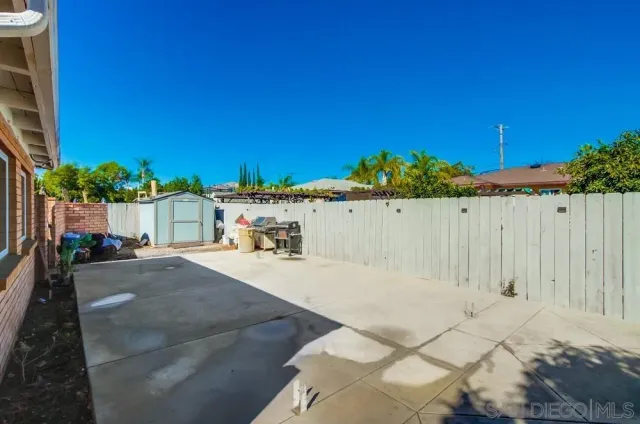 a kitchen with stainless steel appliances granite countertop a refrigerator stove and white cabinets