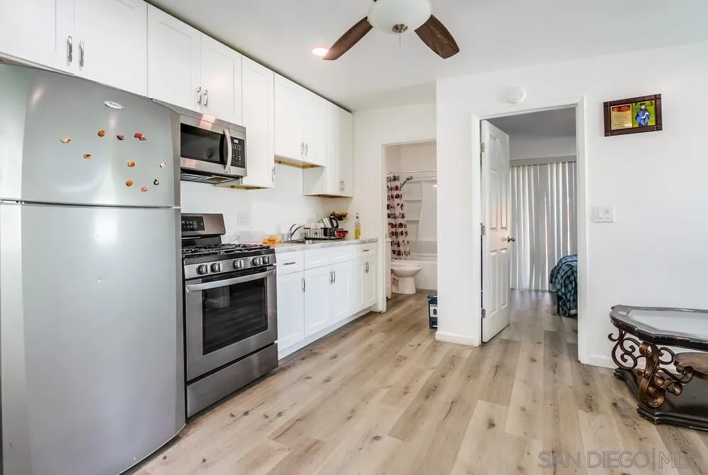 634 Daisy Street Escondido, CA 92027 - Photo 48 of 57 a kitchen with stainless steel appliances a refrigerator stove and sink