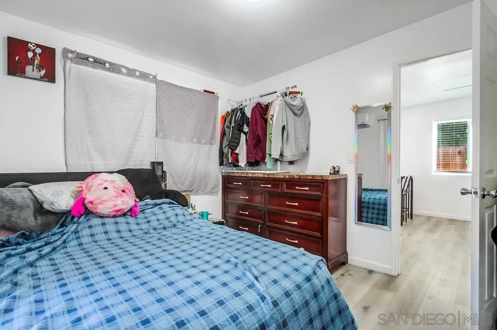 634 Daisy Street Escondido, CA 92027 - Photo 52 of 57 a bedroom with a bed and a dresser in it