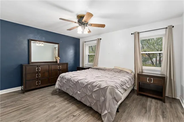 a bedroom with a bed and a dresser