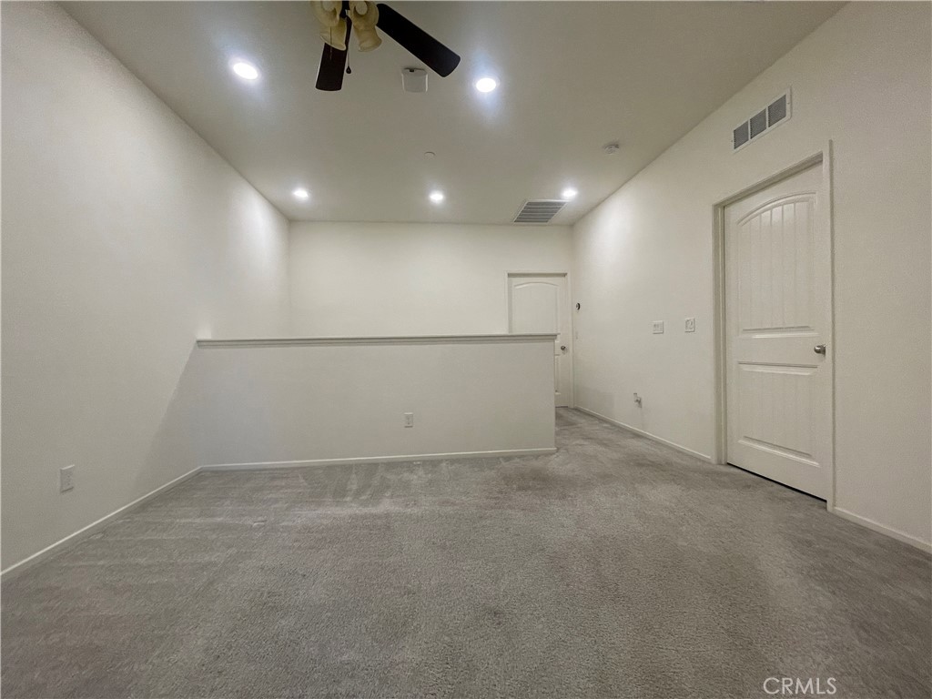 30360 Town Square Drive Menifee, CA 92584 - Photo 13 of 26 an empty room with ceiling fan