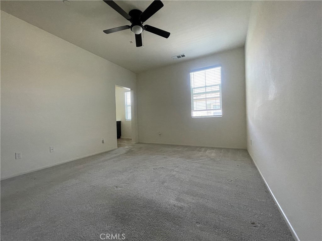 30360 Town Square Drive Menifee, CA 92584 - Photo 14 of 26 an empty room with a window and a fan