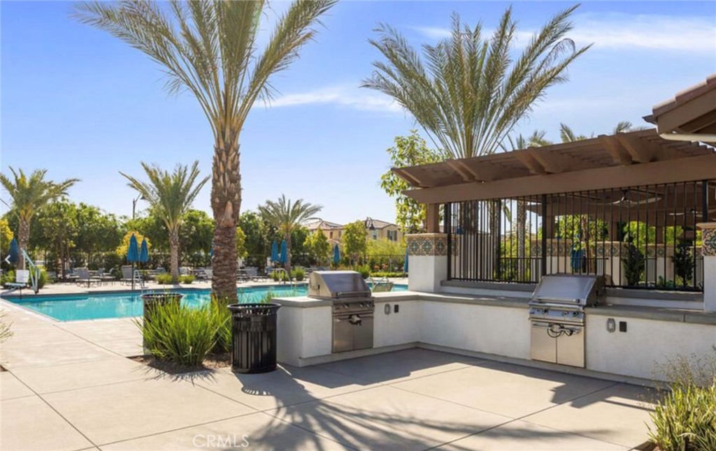 30360 Town Square Drive Menifee, CA 92584 - Photo 26 of 26 a backyard of a house with table and chairs