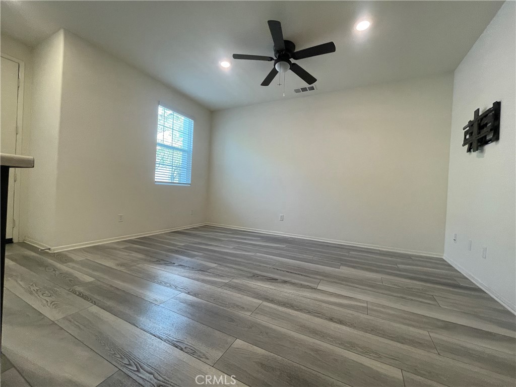 30360 Town Square Drive Menifee, CA 92584 - Photo 9 of 26 wooden floor in an empty room