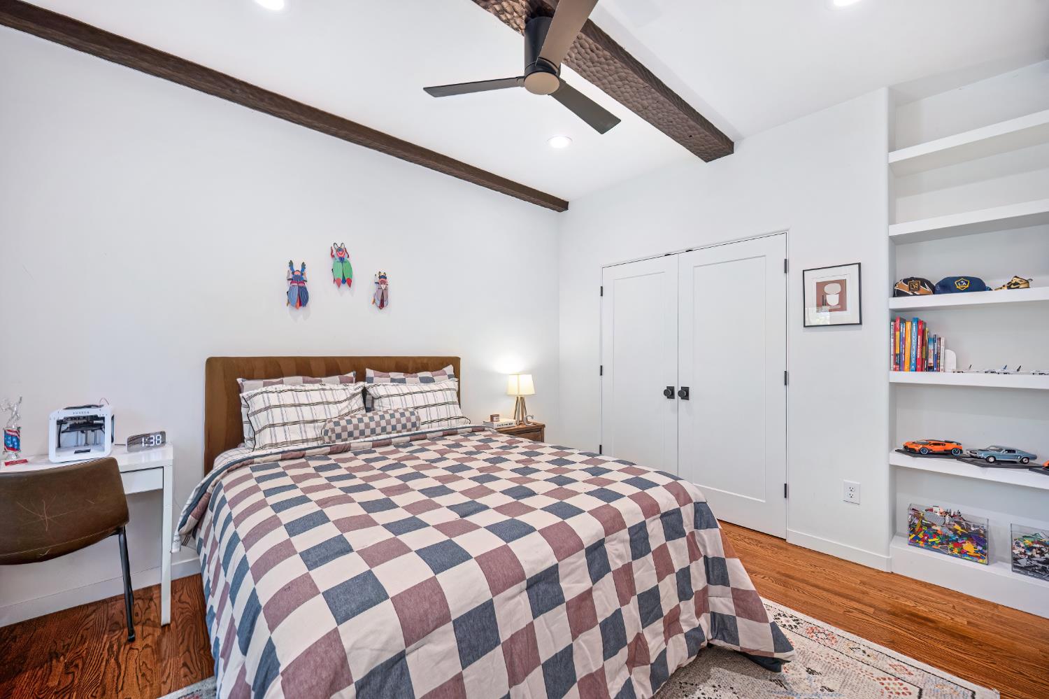 3501 Cutter Way Sacramento, CA 95818 - Photo 34 of 89 a bedroom with a bed and a book shelf