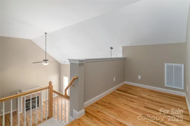 a view of a room with wooden walls