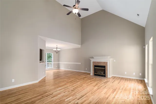 wooden floor fireplace and natural light in room