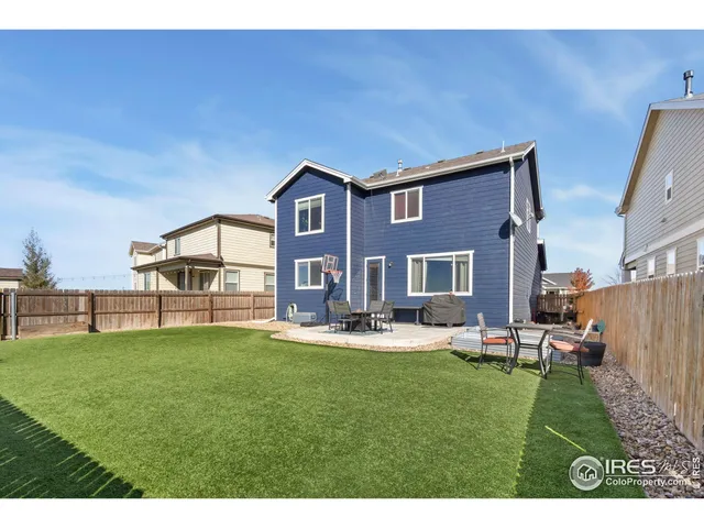 a house view with a sitting space and garden
