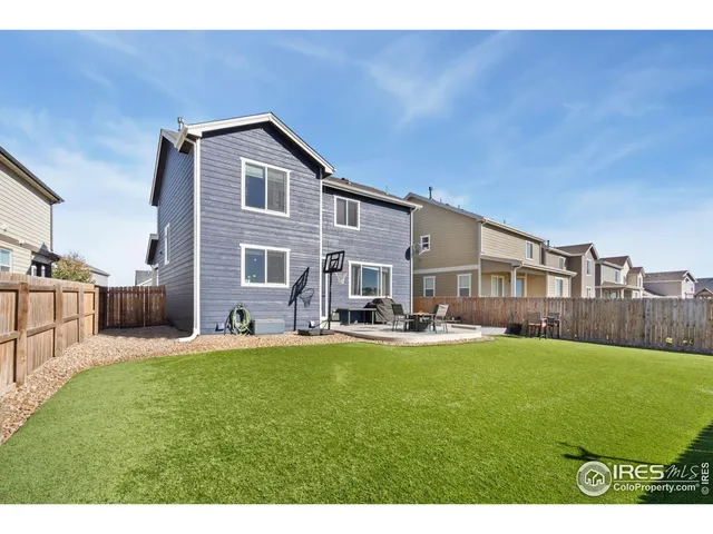 a house view with a sitting space and garden