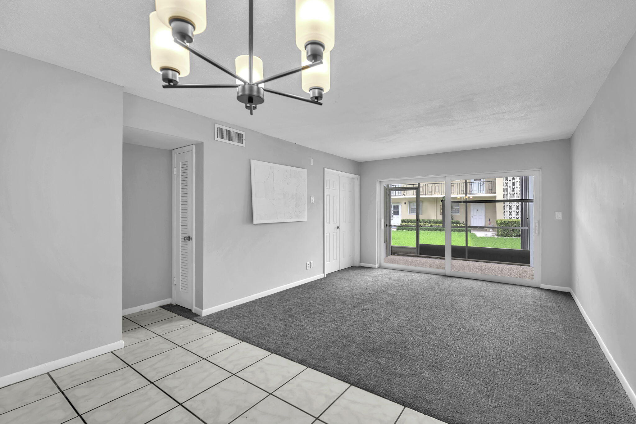 2130 Northeast 36th Street, Unit 63 Lighthouse Point, FL 33064 - Photo 11 of 21 a view of an empty room with a window