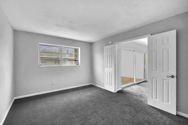 a view of an empty room with a window