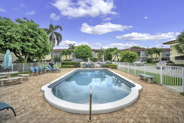a view of a swimming pool with a patio