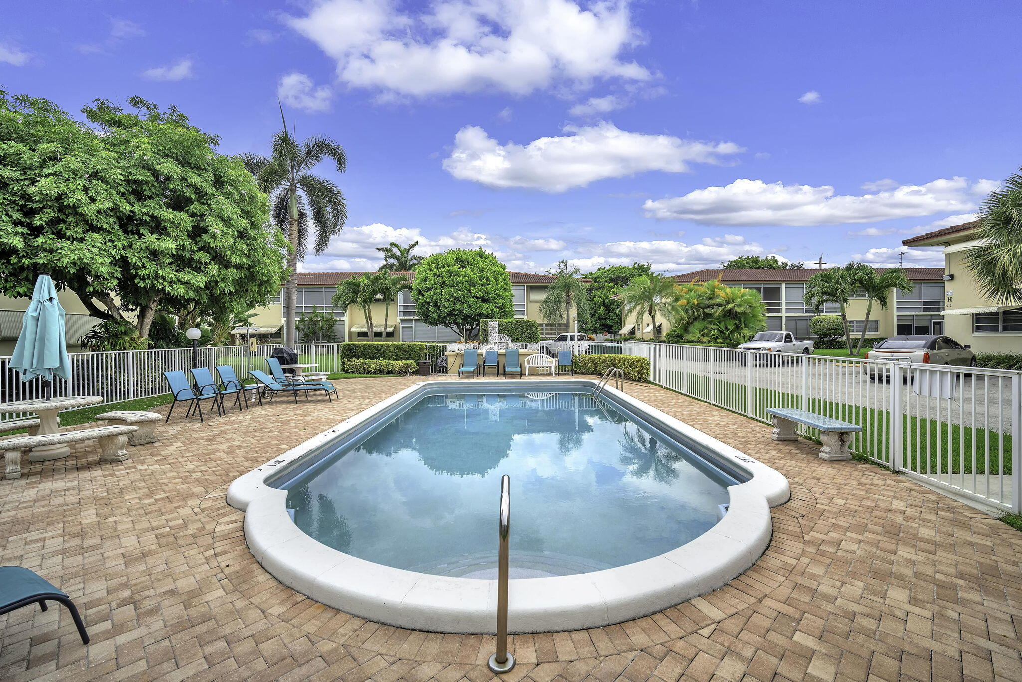 2130 Northeast 36th Street, Unit 63 Lighthouse Point, FL 33064 - Photo 21 of 21 a view of a swimming pool with a patio