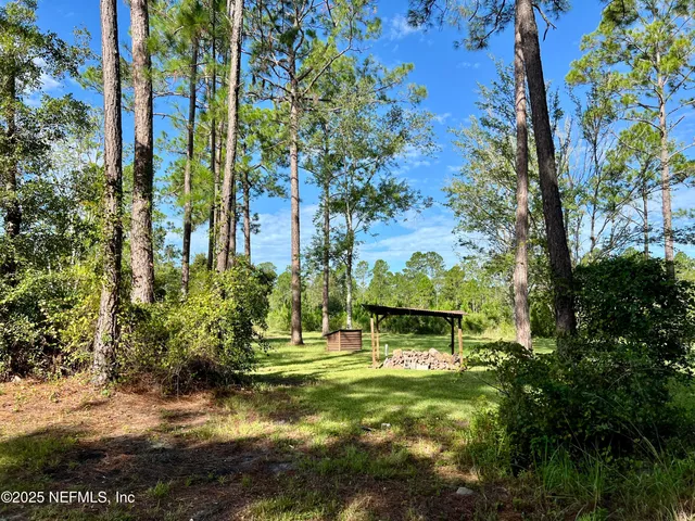 a kitchen with a sink window and cabinets