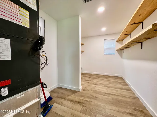a room with a window and wooden floor