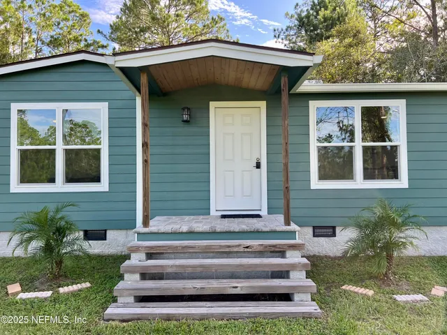 a view of a park with large trees