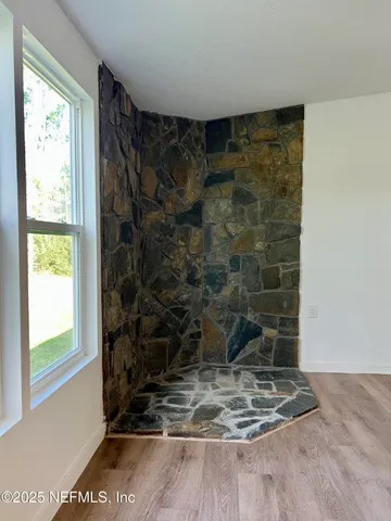 a bathroom with a granite countertop sink mirror vanity and toilet