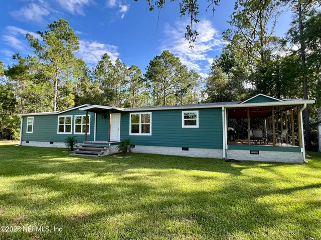 a view of a park with trees and grass