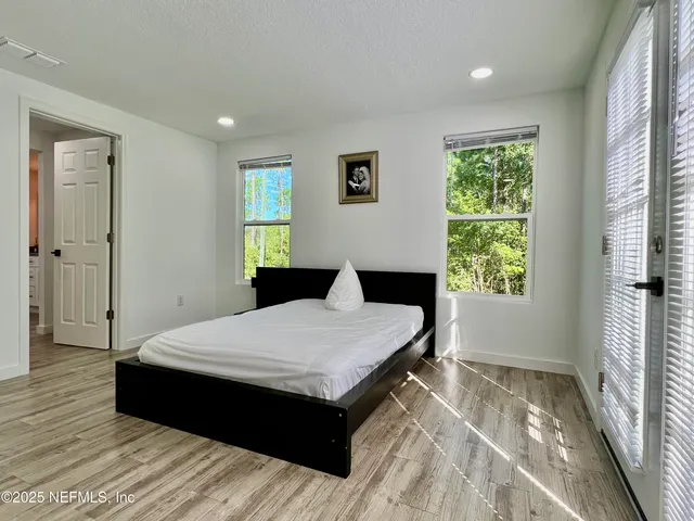 a view of a patio with table and chairs