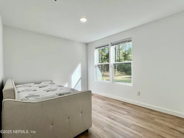 a view of a lake with a building in the background