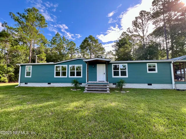 front view of a house with a yard