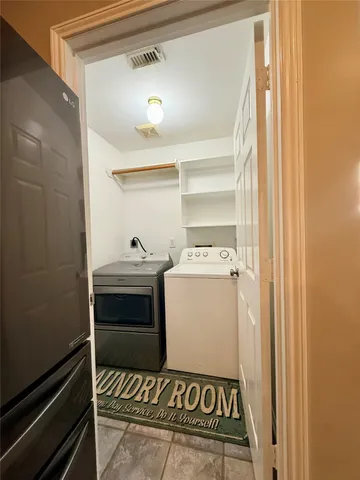 a utility room with washer and dryer
