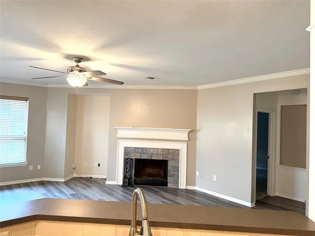 a living room with a fireplace furniture and a window