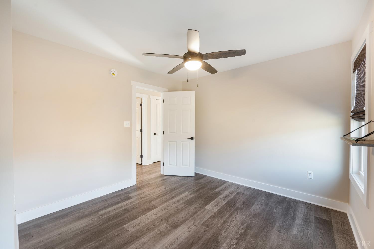 144 Armistead Lane Rustburg, VA 24588 - Photo 29 of 64 a view of empty room with wooden floor and fan