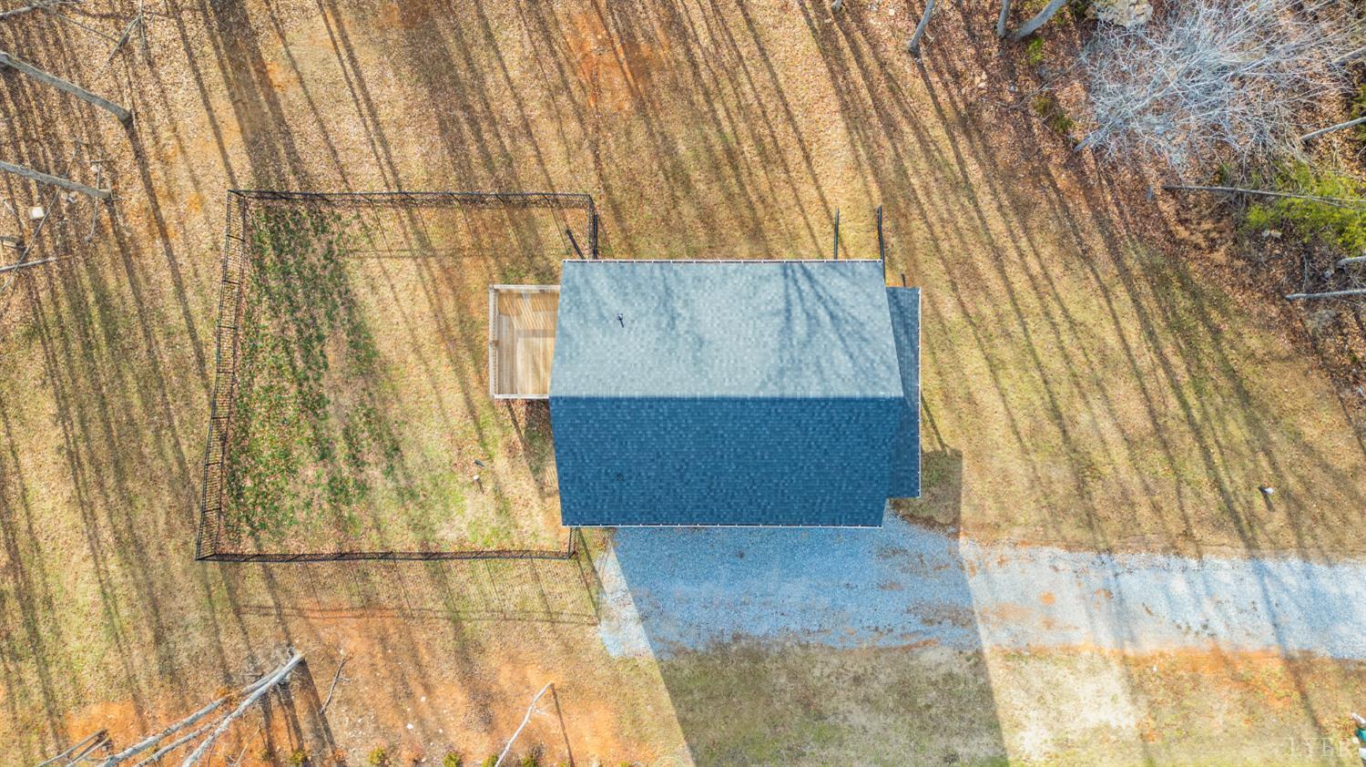 144 Armistead Lane Rustburg, VA 24588 - Photo 42 of 64 a bathroom with a shower curtain and a window