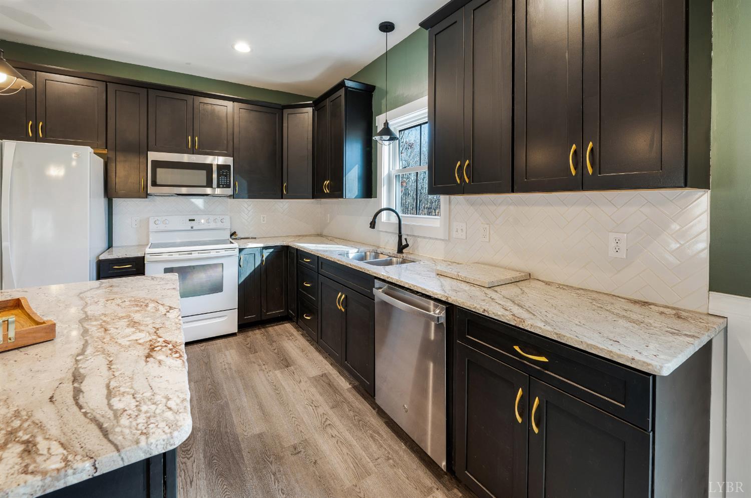 144 Armistead Lane Rustburg, VA 24588 - Photo 9 of 64 a kitchen with stainless steel appliances granite countertop a sink stove microwave and cabinets
