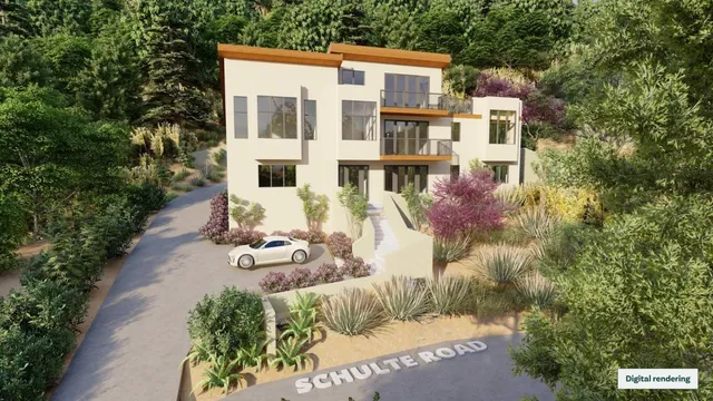 front view of a house with a yard