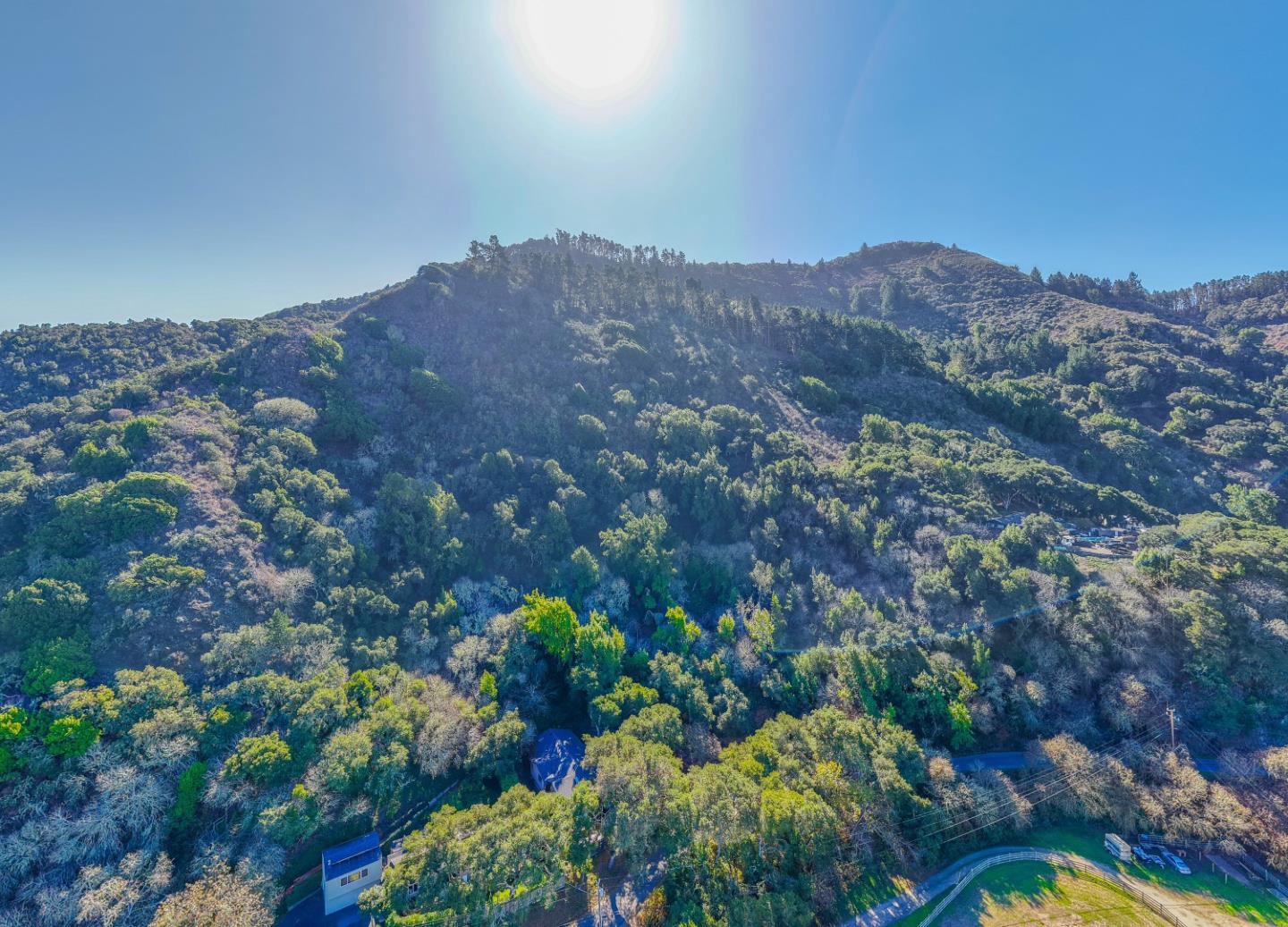 27631 Schulte Road Carmel, CA 93923 - Photo 7 of 21 a view of a lush green field with mountains in the background