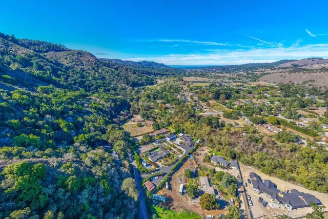 a view of a city with mountains in the background